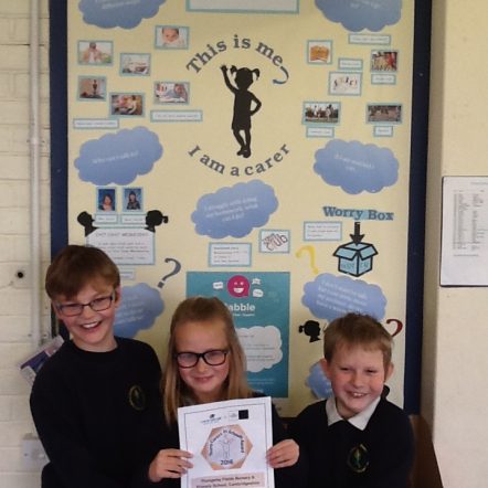 Children holding Bronze Award for supporting Young Carers