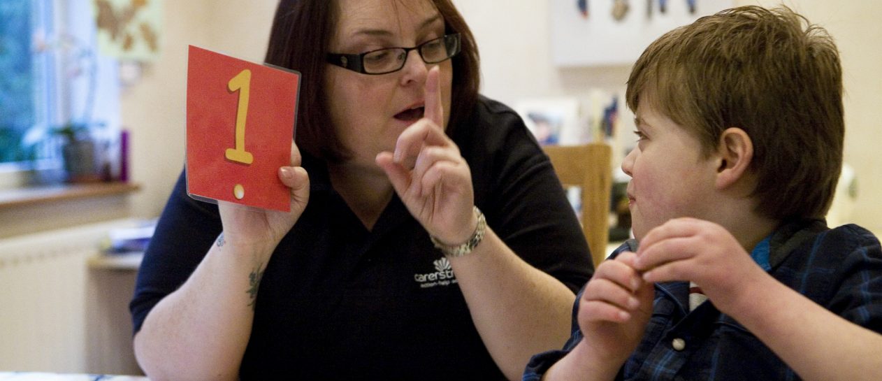 carer support worker providing respite activity for seven year old boy