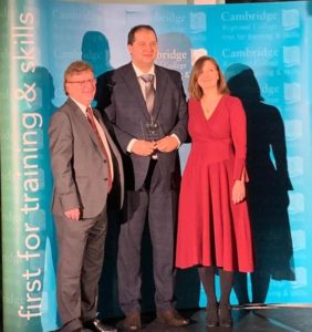 Employer of the Year for Health and Social Care at the Cambridge Regional College Apprenticeship Awards 2020. Anna Bainbridge and Michal Morkowski of Caring Together were presented with the award by Mark Robertson, principal of Cambridge Regional College.