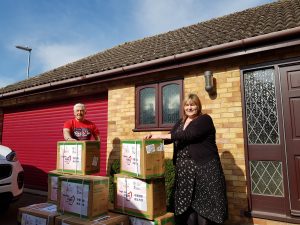 Taking delivery of PPE from John McLean, chair of Carers Trust