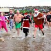 Group running into sea - Christmas Day swim