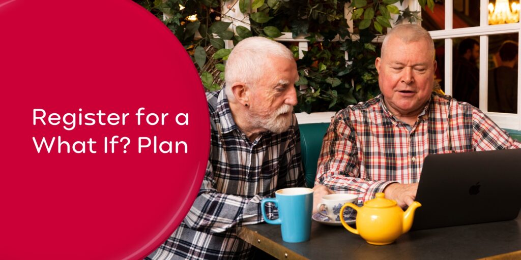 Two men sitting at a table looking at a laptop. Wording 'Register for a What If? Plan'.