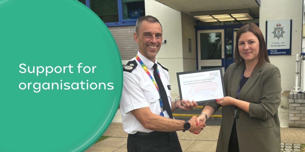 Jill, our Awareness and Voice Coordiantor, presenting a Carer Friendly Tick Award - Employer certificate to Bedfordshire, Cambridgshire and Hertfordshire Police forces. Wording 'Support for organisations'.
