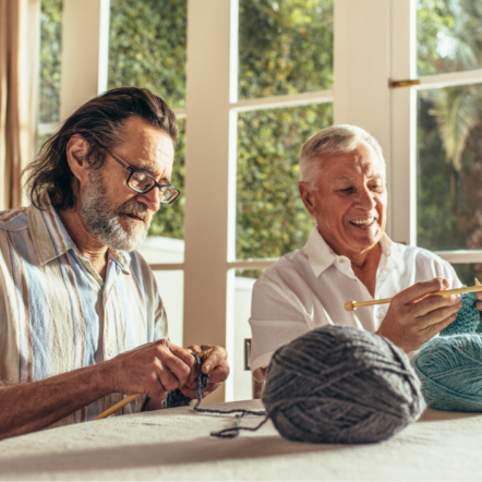 Two men knitting