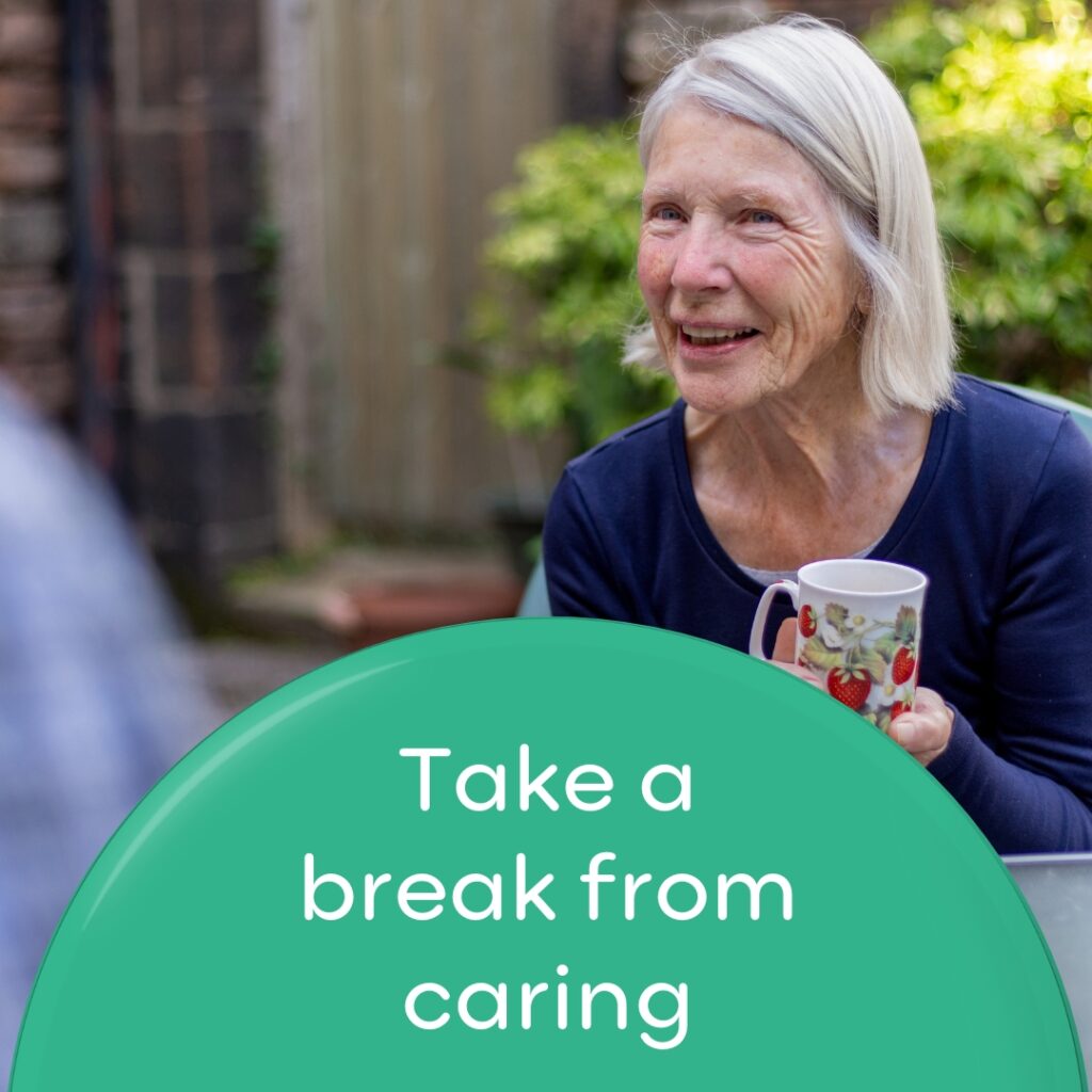 Lady chatting holding a mug. Wording 'Take a break from caring'.